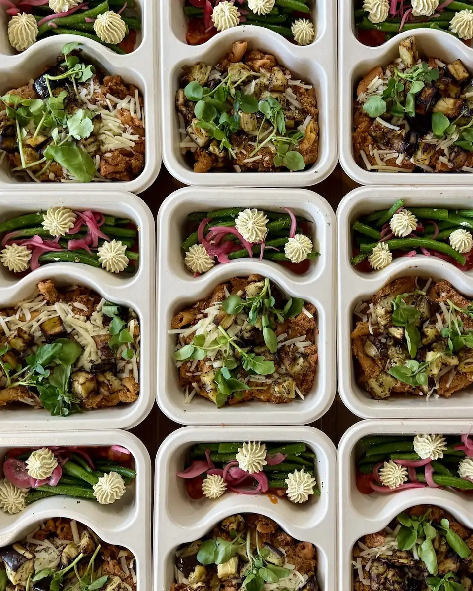 Overhead view of plated meals ready for the case